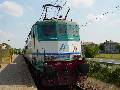 FS locomotive 424 296 with a local train leaving Madignano (Cremona)
train-stop for Cremona on May 16th, 2003.