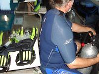 DSC02258 A fellow diver getting his tank well strapped on his BC.